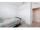 Cozy bedroom featuring plush carpeting, closet space, and a comfortable bed at 668 Tiarella Ln, Henderson, NV 89015