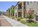 Attractive townhomes with manicured landscaping, sidewalks, and convenient street parking available at 668 Tiarella Ln, Henderson, NV 89015