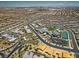 An aerial view showcasing the community clubhouse, community tennis courts, and neighborhood at 6804 Regency Stone Way, Las Vegas, NV 89148