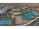 Panoramic aerial view highlighting tennis courts, bocce ball and a community clubhouse, all well-maintained at 6804 Regency Stone Way, Las Vegas, NV 89148