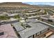 An aerial view of the home showcasing the landscaping, tile roof and mountain views at 6804 Regency Stone Way, Las Vegas, NV 89148