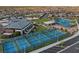Stunning aerial view showcasing community amenities, including tennis courts and a recreation center at 6804 Regency Stone Way, Las Vegas, NV 89148