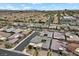 An aerial view shows the neighborhood, streetscapes, landscaping, and architectural styles of homes at 6804 Regency Stone Way, Las Vegas, NV 89148