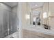 Bright bathroom featuring a glass enclosed shower and a modern vanity with sleek finishes at 6804 Regency Stone Way, Las Vegas, NV 89148