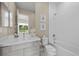 Bathroom featuring neutral decor, light countertops and modern fixtures at 6804 Regency Stone Way, Las Vegas, NV 89148