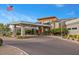 Community clubhouse featuring modern architecture and lush landscaping at 6804 Regency Stone Way, Las Vegas, NV 89148