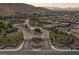 Community entrance featuring a gate and well-maintained landscaping at 6804 Regency Stone Way, Las Vegas, NV 89148