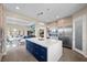 Spacious kitchen with a large island, stainless steel appliances, and an open view to the dining and living areas at 6804 Regency Stone Way, Las Vegas, NV 89148