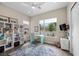 Bright office with built-in shelving, desk, and a view of the outdoors at 6804 Regency Stone Way, Las Vegas, NV 89148