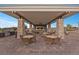 Outdoor kitchen and dining area, perfect for entertaining guests at 6804 Regency Stone Way, Las Vegas, NV 89148
