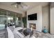 Outdoor patio with a fireplace, seating, and garden at 6804 Regency Stone Way, Las Vegas, NV 89148