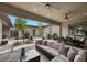 Spacious covered patio with outdoor seating and grill area at 6804 Regency Stone Way, Las Vegas, NV 89148