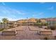 Community recreation area featuring dual bocce ball courts, bench seating, beautiful landscaping and mountain views at 6804 Regency Stone Way, Las Vegas, NV 89148