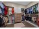 Spacious walk-in closet with ample shelving, hanging space, and a stylish wood floor at 6804 Regency Stone Way, Las Vegas, NV 89148