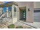 Inviting home exterior featuring a teal front door and a stylish brick walkway at 6834 Compass St, North Las Vegas, NV 89084