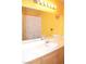 Bright bathroom with a large mirror and a vanity, complemented by butterfly wall decor and a shower with butterfly curtains at 7340 Alpine Ridge St, Las Vegas, NV 89131