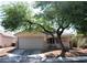 Charming single-story home featuring a two-car garage and low-maintenance desert landscaping in front at 7340 Alpine Ridge St, Las Vegas, NV 89131