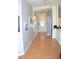 Well-lit hallway with hardwood floors, neutral walls, and an inviting entrance at 7340 Alpine Ridge St, Las Vegas, NV 89131