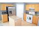 Bright eat-in kitchen featuring wooden cabinetry, stainless-steel appliances, and granite countertops at 7340 Alpine Ridge St, Las Vegas, NV 89131