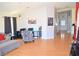 Open-concept living room featuring bright hardwood floors and neutral wall colors at 7340 Alpine Ridge St, Las Vegas, NV 89131