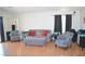 Spacious living room featuring wood-look flooring, and lots of natural light at 7340 Alpine Ridge St, Las Vegas, NV 89131