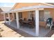 Inviting covered patio area with a dining set, perfect for outdoor entertaining and relaxation at 7340 Alpine Ridge St, Las Vegas, NV 89131