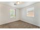 Neutral bedroom with carpet, natural light from two windows, offering a serene and comfortable living space at 7553 Virginia Dale St, Las Vegas, NV 89131