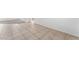 Tile flooring leading into the living room featuring carpet and plenty of natural light at 7553 Virginia Dale St, Las Vegas, NV 89131