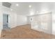 Spacious loft area with carpet floors, bright natural light, and stairway entrance at 7553 Virginia Dale St, Las Vegas, NV 89131
