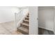 Carpeted staircase with white railing, leading to upper level at 7553 Virginia Dale St, Las Vegas, NV 89131