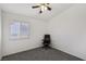 Simple bedroom featuring neutral carpet, a ceiling fan, and a window at 7927 Villa Salsa Ave, Las Vegas, NV 89131
