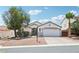 Charming single story home with a desert landscape and a two car garage and beautiful blue skies at 7927 Villa Salsa Ave, Las Vegas, NV 89131