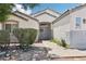Inviting front entrance with a double door and lovely landscape for increased curb appeal at 7927 Villa Salsa Ave, Las Vegas, NV 89131