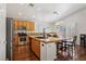 Bright eat-in kitchen features granite countertops, stainless steel appliances and wood cabinetry at 7927 Villa Salsa Ave, Las Vegas, NV 89131