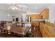 Open concept Kitchen with island with counter seating and stainless steel appliances at 7927 Villa Salsa Ave, Las Vegas, NV 89131