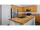 Spacious kitchen with granite countertops, oak cabinets, and stainless steel appliances at 7927 Villa Salsa Ave, Las Vegas, NV 89131