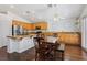 The kitchen features a large island with granite countertops and a stainless steel refrigerator at 7927 Villa Salsa Ave, Las Vegas, NV 89131