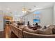 Open concept Living Room and Kitchen with Hardwood Floors and lots of natural light at 7927 Villa Salsa Ave, Las Vegas, NV 89131