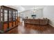 Spacious open-concept living room with hardwood floors, vaulted ceilings and a ceiling fan at 7927 Villa Salsa Ave, Las Vegas, NV 89131