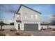 Modern two-story home with clean lines, desert landscaping, and a two-car garage at 8154 Rockflower St, Las Vegas, NV 89113