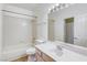 Bathroom with a tub-shower combo, large mirror, and vanity at 8301 Boseck Dr # 232, Las Vegas, NV 89145