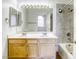 Bathroom featuring double sinks, a large mirror, and a shower-tub combo at 8301 Boseck Dr # 232, Las Vegas, NV 89145