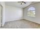 Spacious bedroom boasting vaulted ceilings, large window, and neutral carpeting at 8301 Boseck Dr # 232, Las Vegas, NV 89145