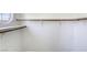 Walk-in closet with shelves and wooden rods at 8301 Boseck Dr # 232, Las Vegas, NV 89145