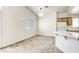 Inviting dining area featuring plush carpeting, bright window, and a modern light fixture at 8301 Boseck Dr # 232, Las Vegas, NV 89145
