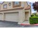 Close-up view of a townhome entrance with a private garage at 8301 Boseck Dr # 232, Las Vegas, NV 89145