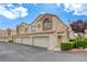 Inviting townhome featuring a two-car garage and a cozy entryway at 8301 Boseck Dr # 232, Las Vegas, NV 89145