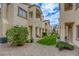 Exterior view of a condo building with well-maintained landscaping at 8301 Boseck Dr # 232, Las Vegas, NV 89145