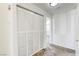 Bright hallway featuring white doors, trim, and a neutral carpet at 8301 Boseck Dr # 232, Las Vegas, NV 89145