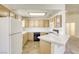 Classic kitchen featuring wooden cabinets, white countertops, and black appliances at 8301 Boseck Dr # 232, Las Vegas, NV 89145